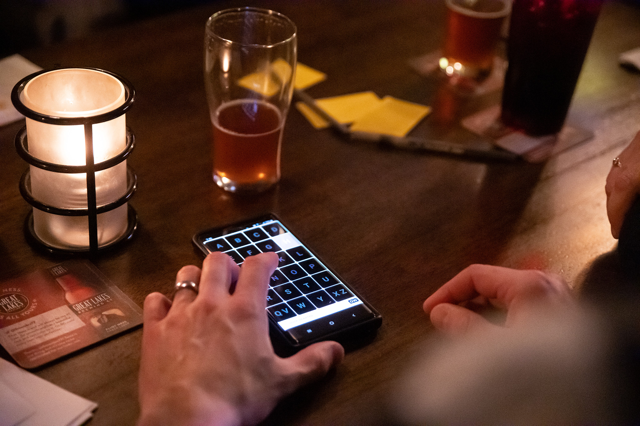 U Pick 6 Pub Trivia smart phone on table